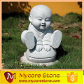 Cute hand-carved Temple monk stone sculpture